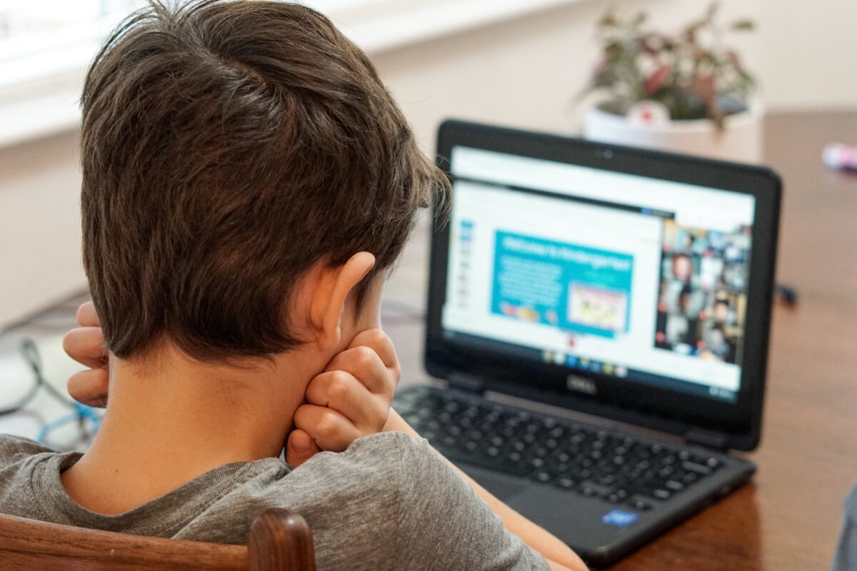 Boy Reading Online Stock Photo
